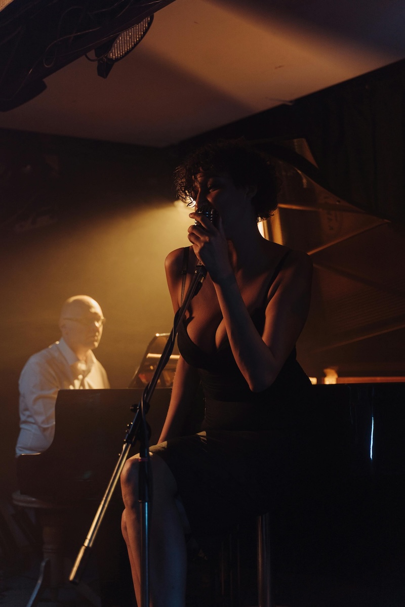 Woman singing into a microphone