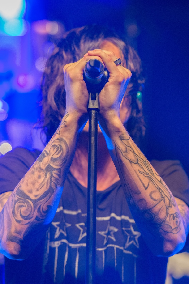 Man singing into microphone Man singing into microphone